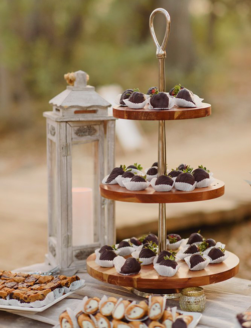 chocolate-covered-strawberries-canolis-brownies-on-dessert-table-at-party