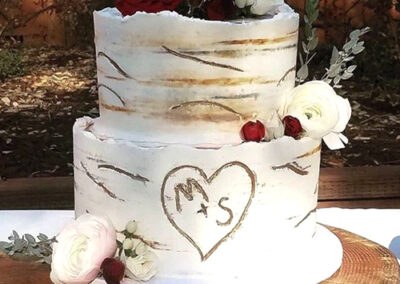 two-tier-custom-wedding-cake-with-red-roses-looks-like-tree-trunk
