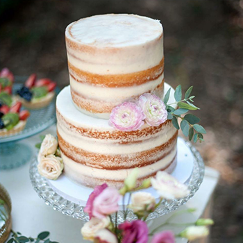 wedding-cake-on-dessert-table-at-wedding